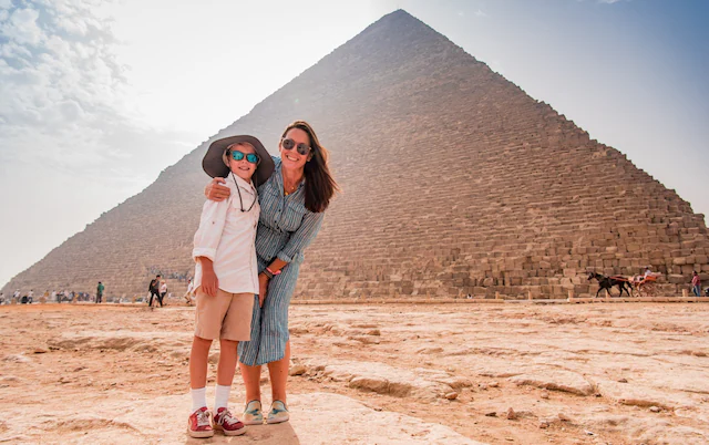Mother and daughter visiting the Giza Pyramids on an Egypt family holiday