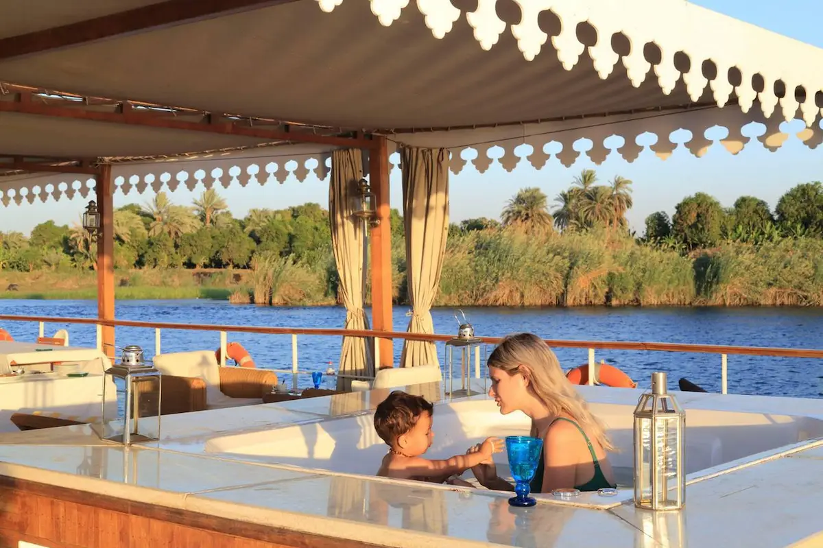 Family relaxing together on a Nile cruise in Egypt