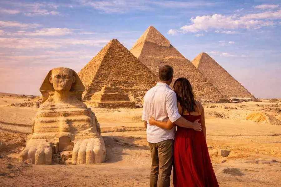 Honeymoon couple overlooking the Giza Pyramids and Great Sphinx