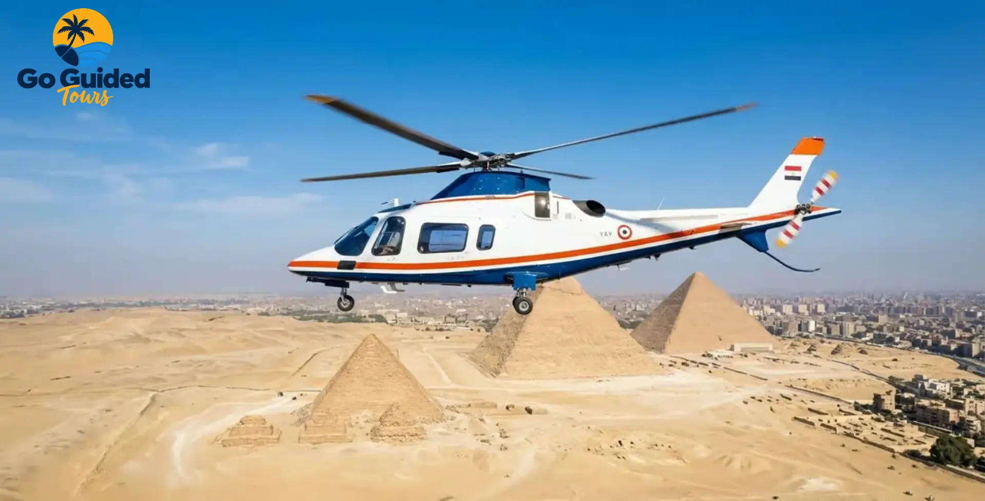 Private helicopter flying above the Pyramids of Giza in Cairo